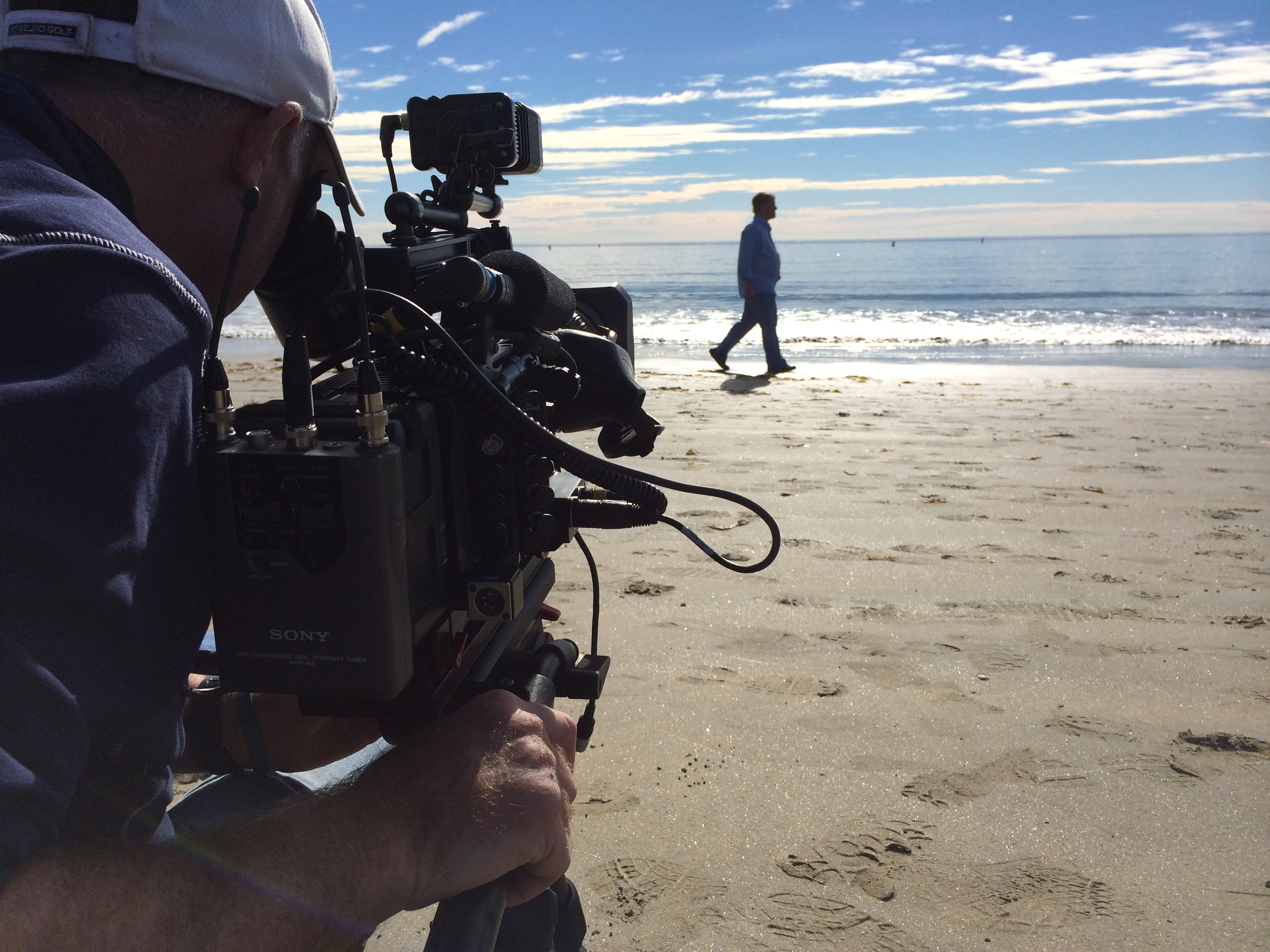 2. Leigh Steinberg walking on a beach